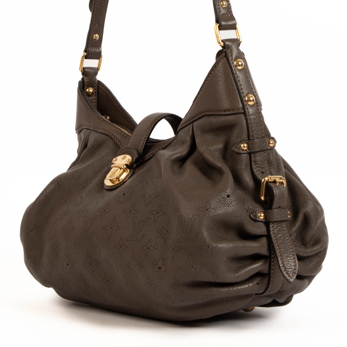 Shop safe online at Labellov in Antwerp, Brussels and Knokke this 100% authentic second hand Louis Vuitton Brown Perforated Monogram Mahina XS Crossbody Bag