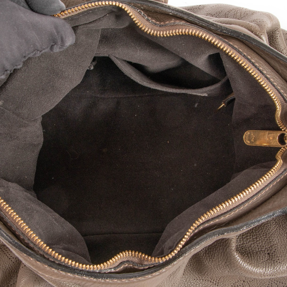 Shop safe online at Labellov in Antwerp, Brussels and Knokke this 100% authentic second hand Louis Vuitton Brown Perforated Monogram Mahina XS Crossbody Bag