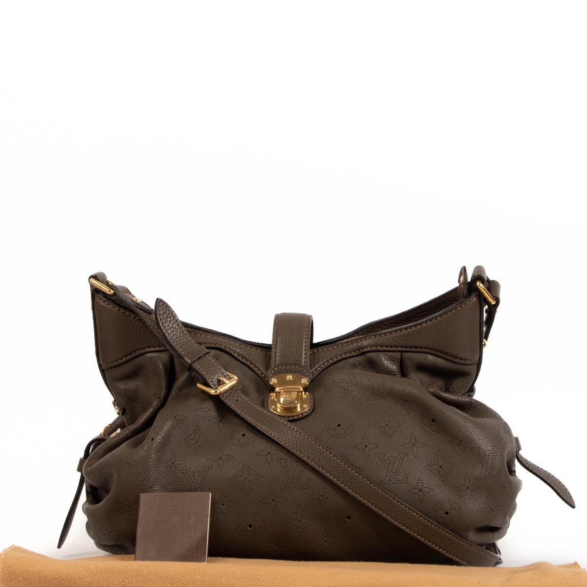 Shop safe online at Labellov in Antwerp, Brussels and Knokke this 100% authentic second hand Louis Vuitton Brown Perforated Monogram Mahina XS Crossbody Bag