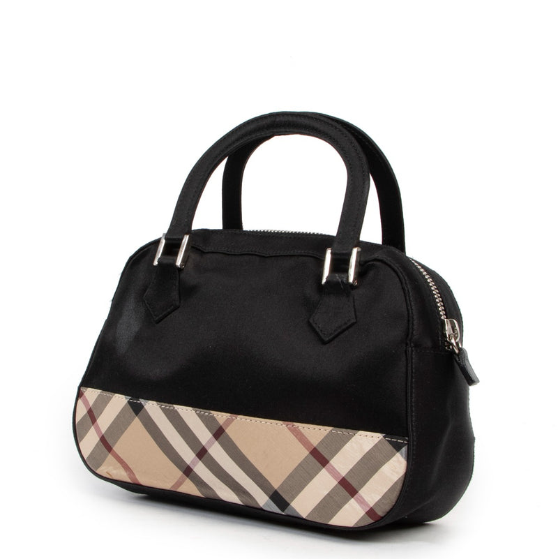 get this Burberry Black Monogram Top Handle at Labellov in very good condition and in fun monogram Check design. Buy online or in store. Buy, sell repeat