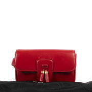 Buy and get this Celine Red Tassel Crossbody at Labellov in very good condition, online or in store at Verlatstraat 15. Add this bag to your collection.
