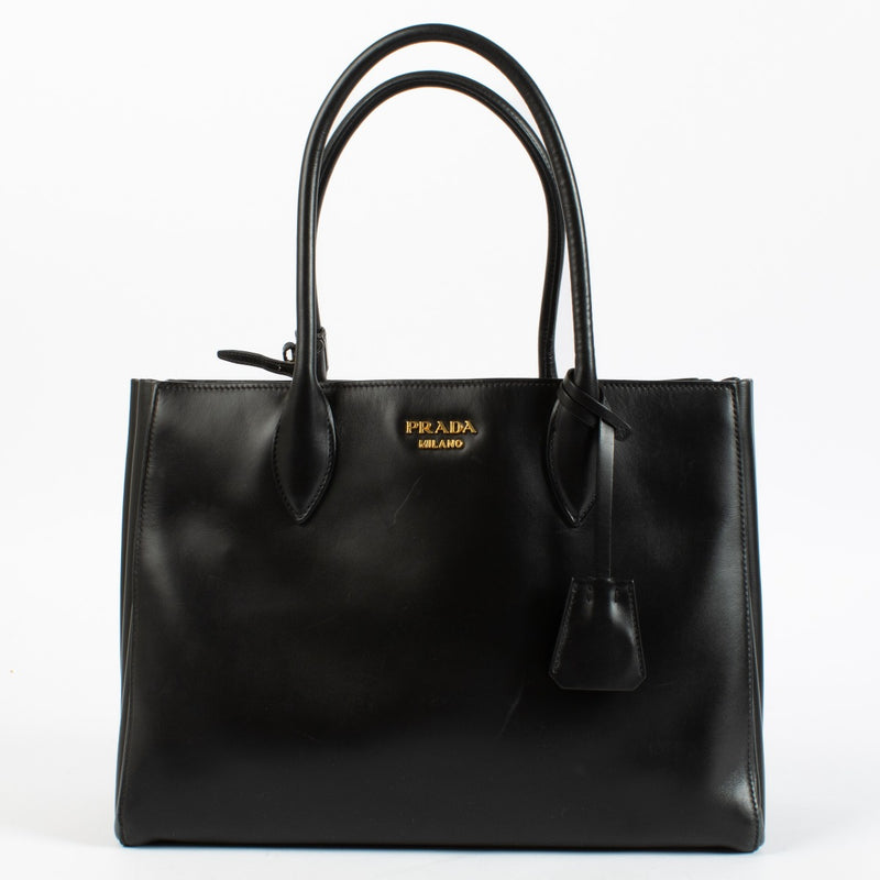 Authentic pre-loved Prada Medium Bibliothèque Tote in calfskin leather with structured silhouette at Labellov.com.