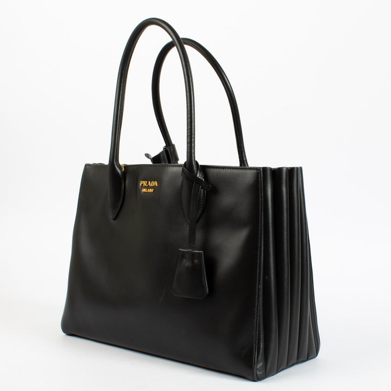 Authentic pre-loved Prada Medium Bibliothèque Tote in calfskin leather with structured silhouette at Labellov.com.