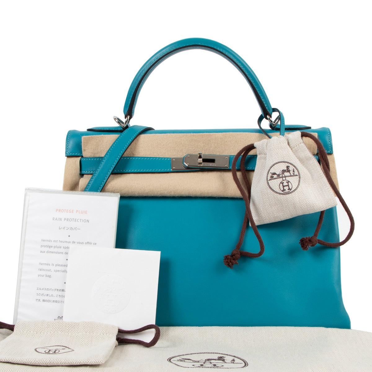 Authentic second hand Hermès Kelly 32 Retourne Bleu Jean Swift Palladium Hardware at Labellov.com