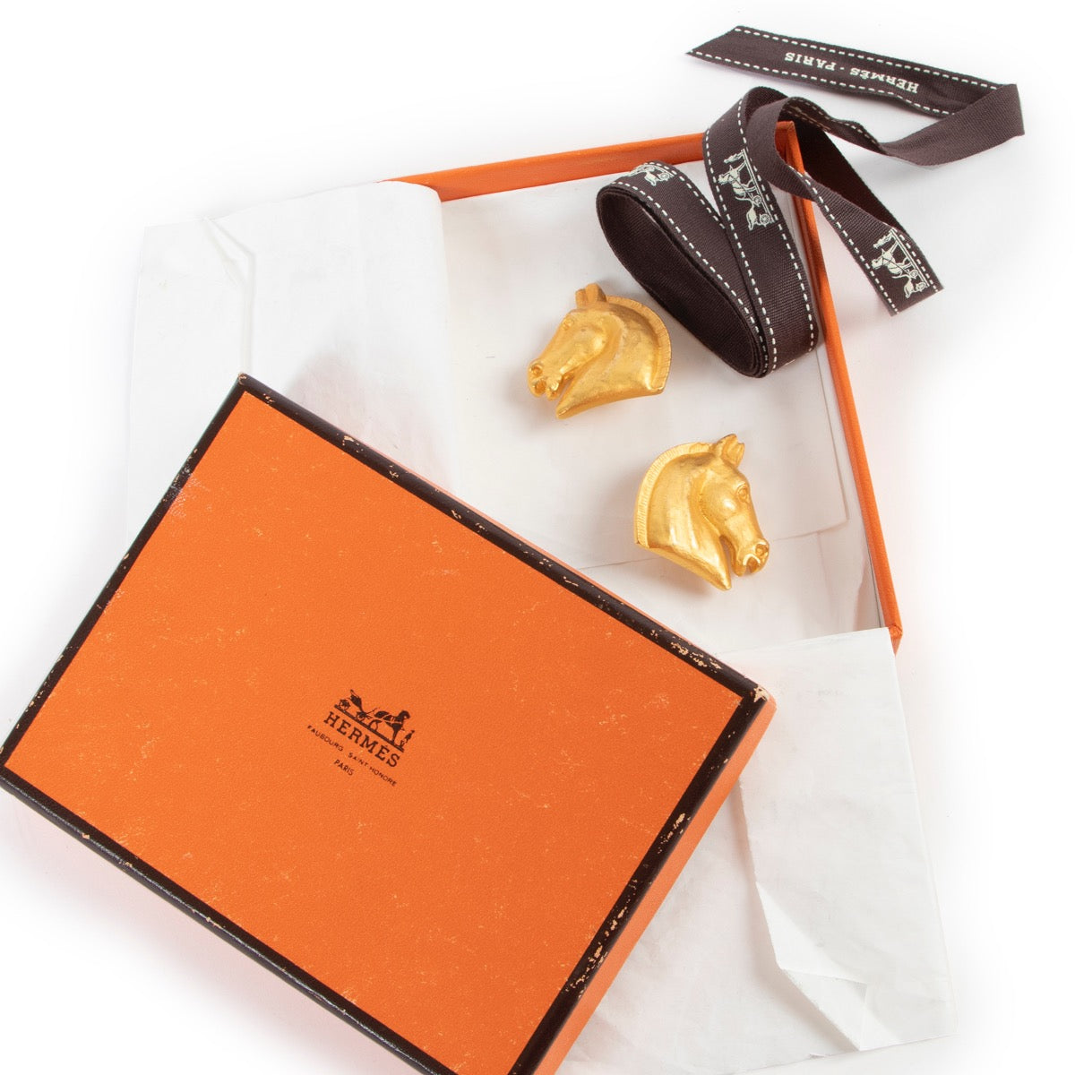 Buy authentic second hand Hermès horse head earrings at Labellov