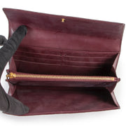Shop safe online at Labellov in Antwerp this 100% authentic second hand Louis Vuitton Purple Vernis Sarah Wallet