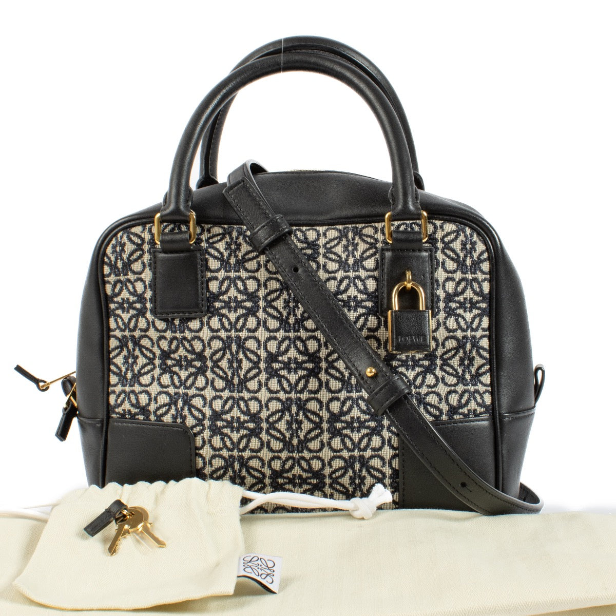 Buy authentic second hand Loewe Black Canvas & Leather Anagram Amazona 19 Top Handle Bag at Labellov.com