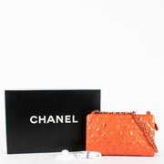 Authentic pre-loved Chanel Orange Patent Precious Symbols Bag on Labellov.com