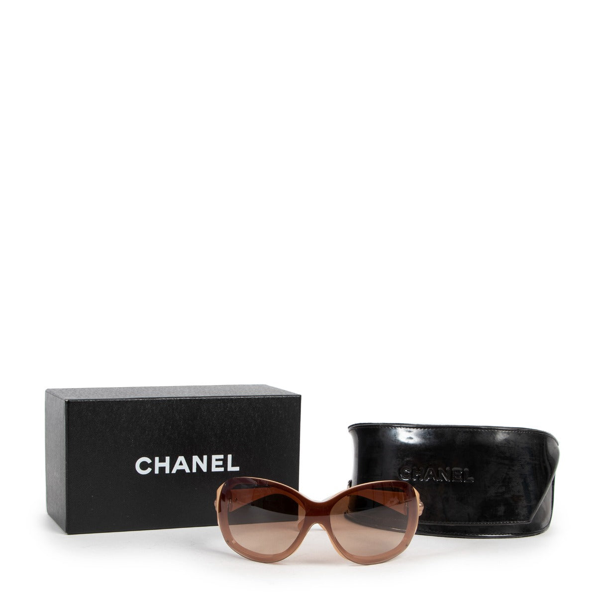 Chanel Beige Sunglasses now available. Shop online 24/7 or get them in our showroom. Consign your designer items at Labellov Luxury