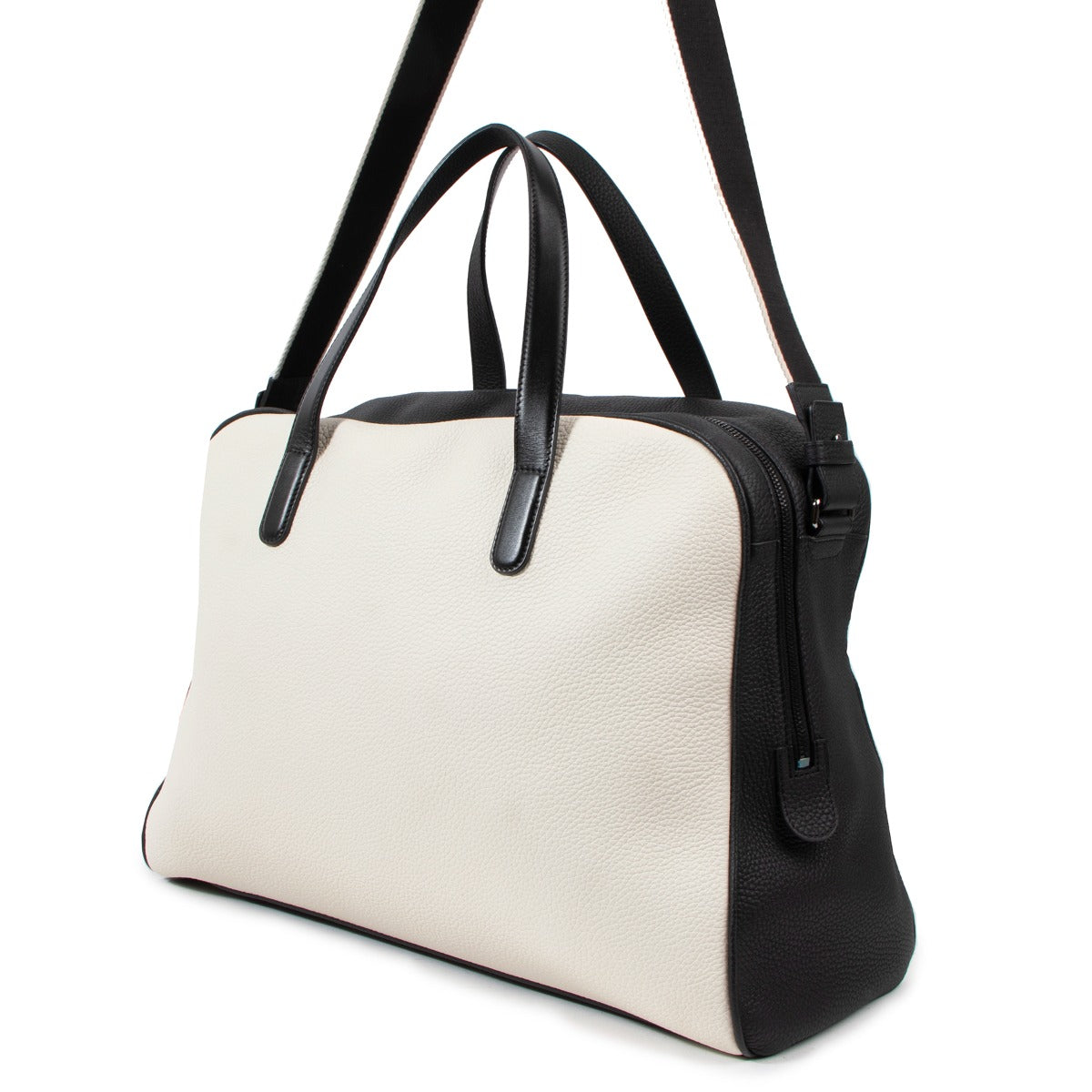 Buy an authentic vintage Delvaux Black Ivory White Leather D-Off Magritte Travel Bag in very good condition at Labellov Antwerp.