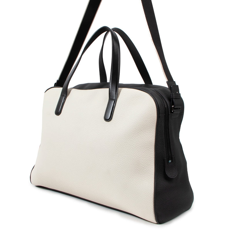 Buy an authentic vintage Delvaux Black Ivory White Leather D-Off Magritte Travel Bag in very good condition at Labellov Antwerp.