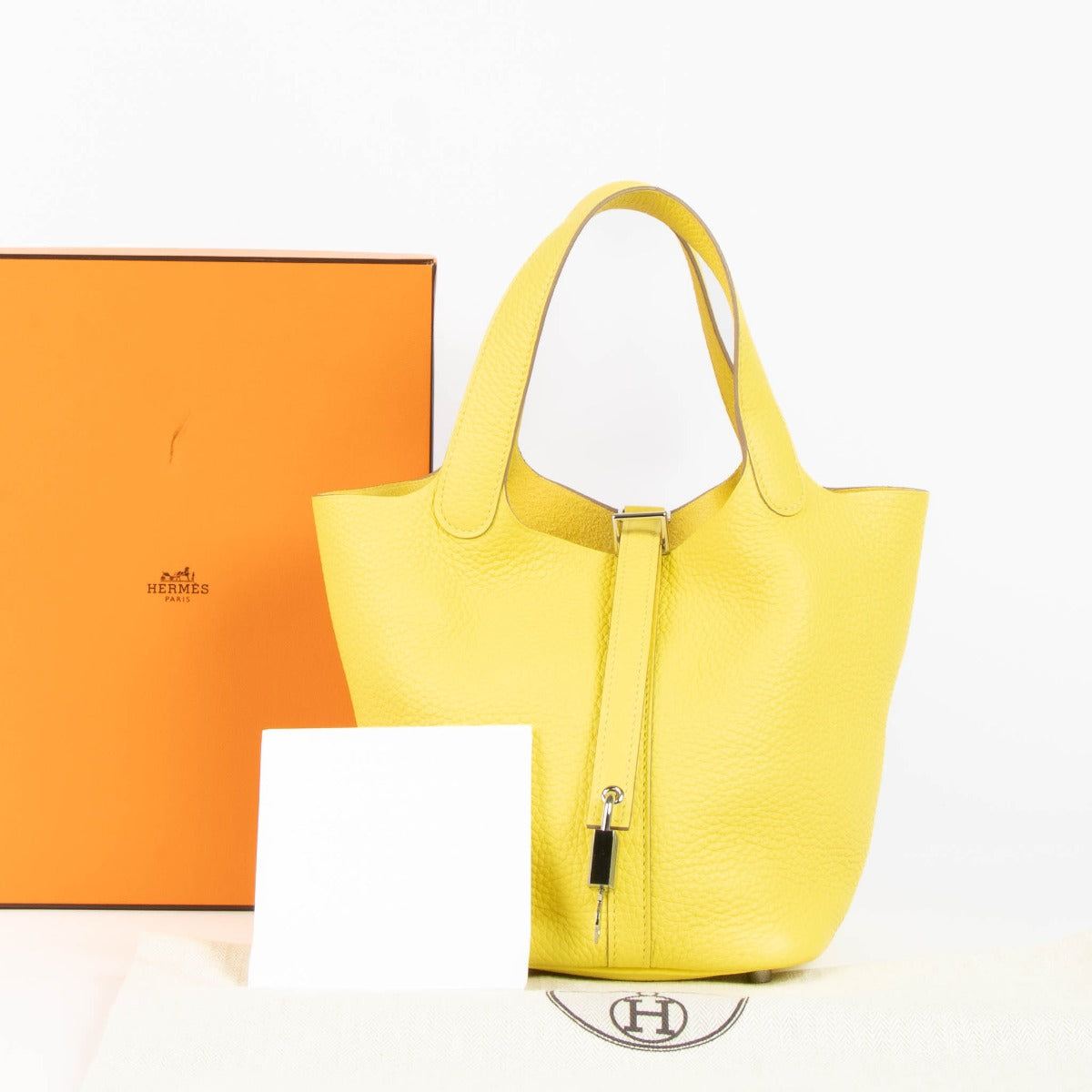 Hermès Picotin Lock 18 Lime Clemence PHW Top Handle Bag for the best price at Labellov seondhand luxury in Antwerp and Knokke.
