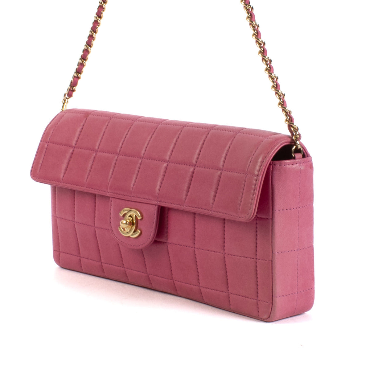 Indulge in the sweet sophistication of the Chanel Pink Chocolate Bar East West Bag, a delightful fusion of elegance and playful charm. This exquisite handbag, crafted by the legendary fashion house Chanel, is designed to add a touch of chic to your wardro