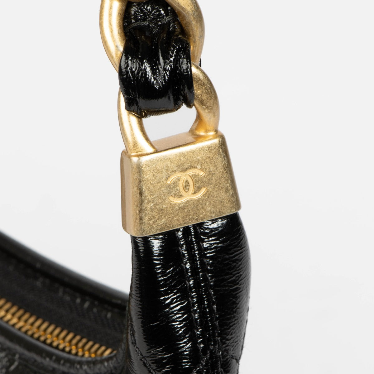 Shop 100% authentic second hand Chanel Black Lambskin Patent Hobo Bag on Labellov.com.