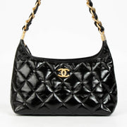 Shop 100% authentic second hand Chanel Black Lambskin Patent Hobo Bag on Labellov.com.