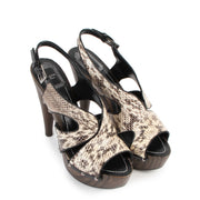 Buy authentic second hand Christian Dior Beige Python wooden High Heels - Size 38,5 in very good condition at Labellov in Antwerp.