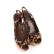 These Louis Vuitton Leopard Print Fabric Bow Cork Wedge Slingback Heels will spice up your basic outfit with. The perfect heel for your day to day lifestyle.