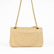 Shop this 100% authentic Chanel Beige Lambskin Small Classic Flap Bag with Gold Hardware at Labellov.com