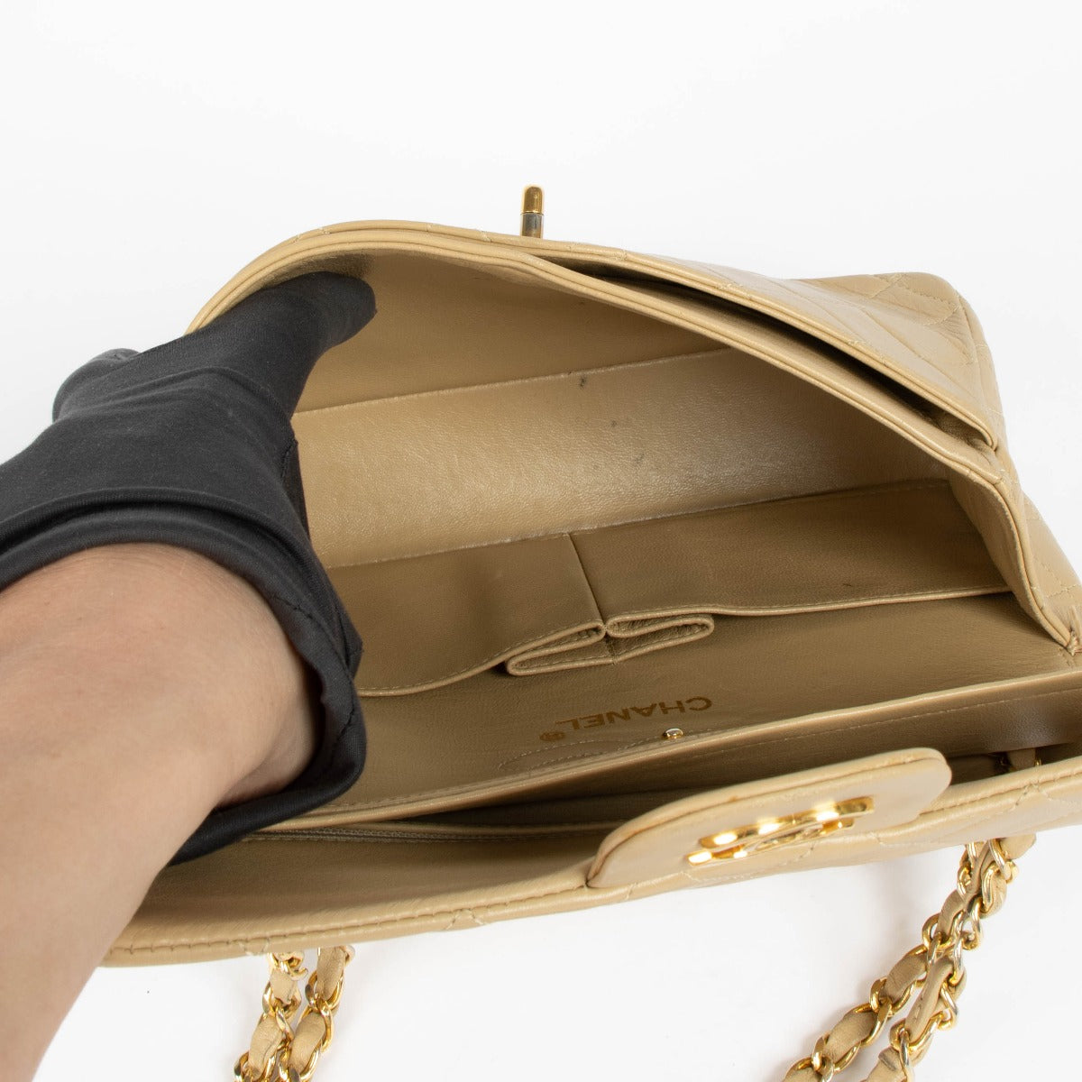 Shop this 100% authentic Chanel Beige Lambskin Small Classic Flap Bag with Gold Hardware at Labellov.com