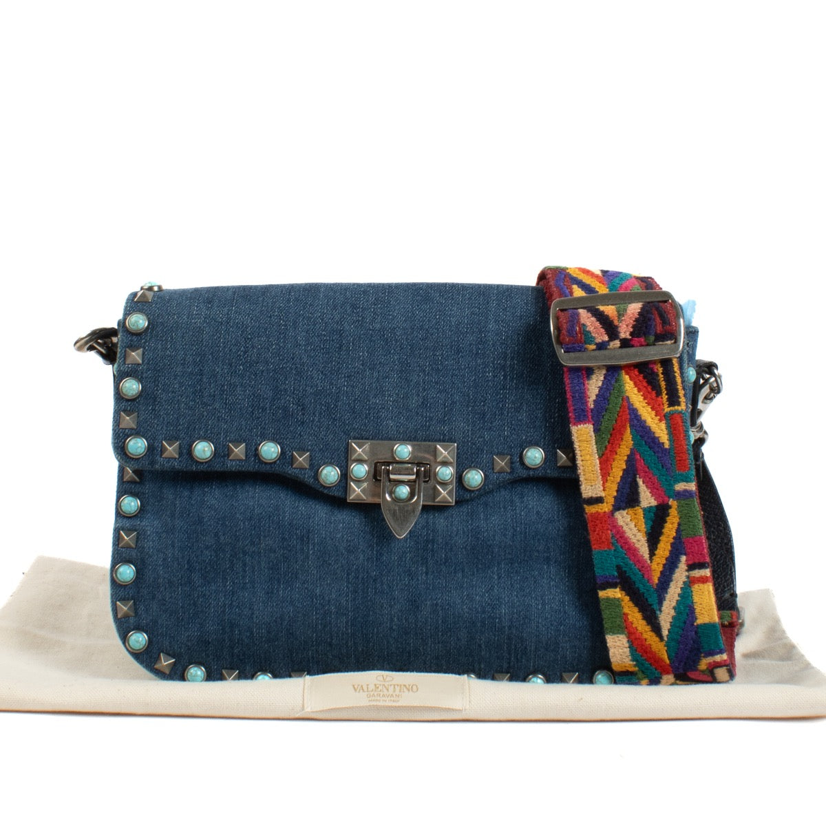 Shop safe online at Labellov in Antwerp and Knokke this 100% authentic second hand Valentino Garavani Denim Rockstud Rolling Rock Crossbody Bag