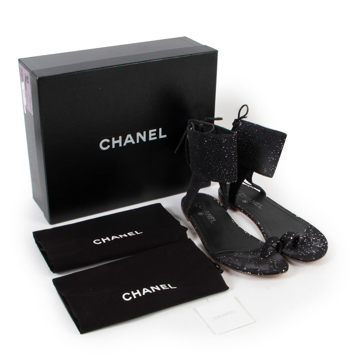 Buy an authentic pair of second hand Chanel 2012 Black Sandals Size 41 in very good condition at Labellov