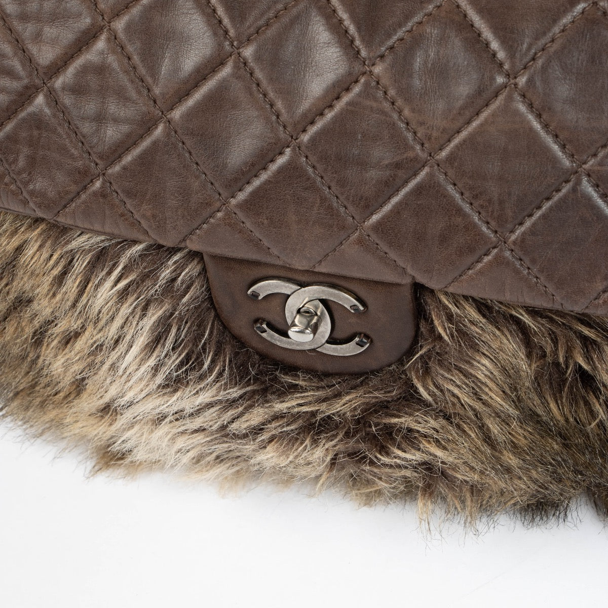 Authentic pre-loved Chanel Brown Quilted Lambskin Fur Flap Bag on Labellov.com