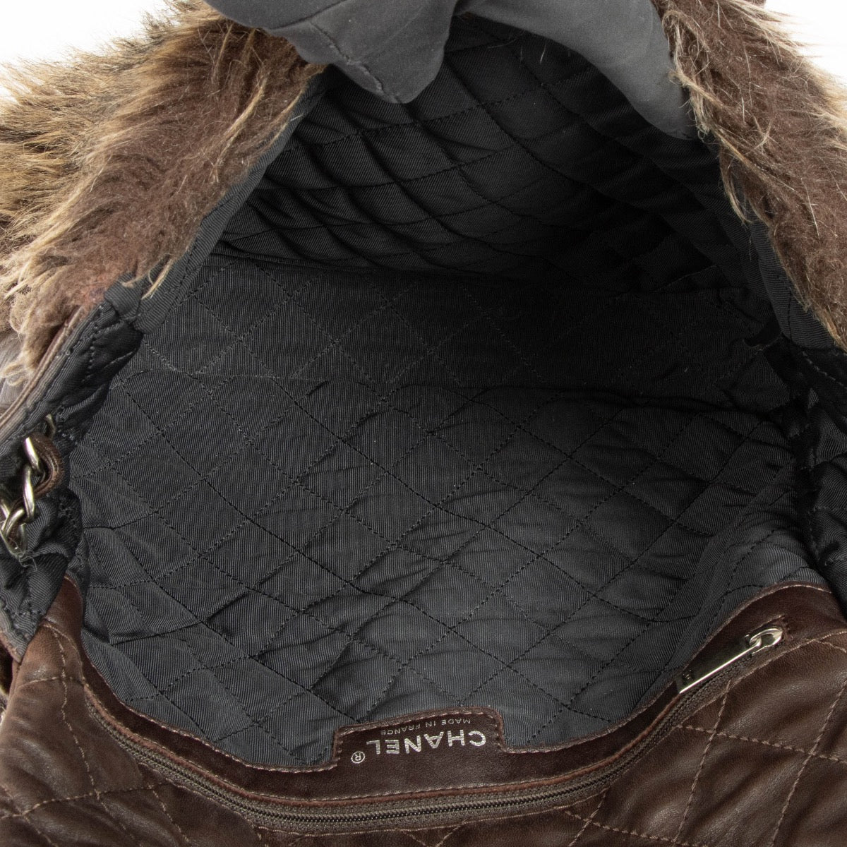 Authentic pre-loved Chanel Brown Quilted Lambskin Fur Flap Bag on Labellov.com