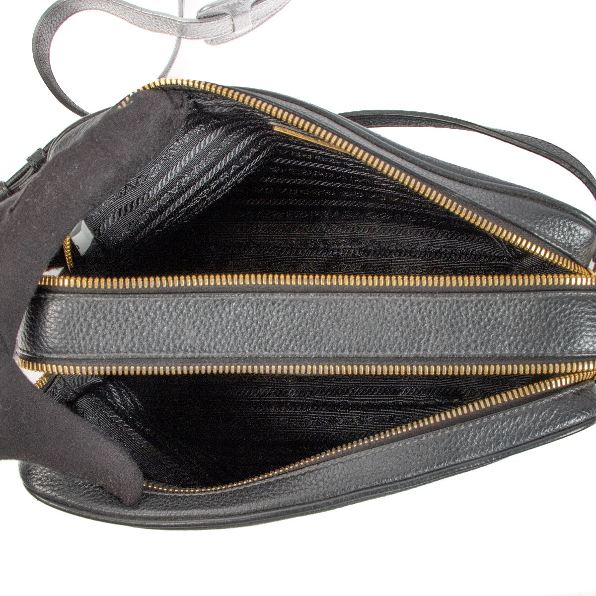Shop safe online at Labellov in Antwerp, Brussels and Knokke this 100% authentic second hand Prada Black Vitello Daino Camera Bag