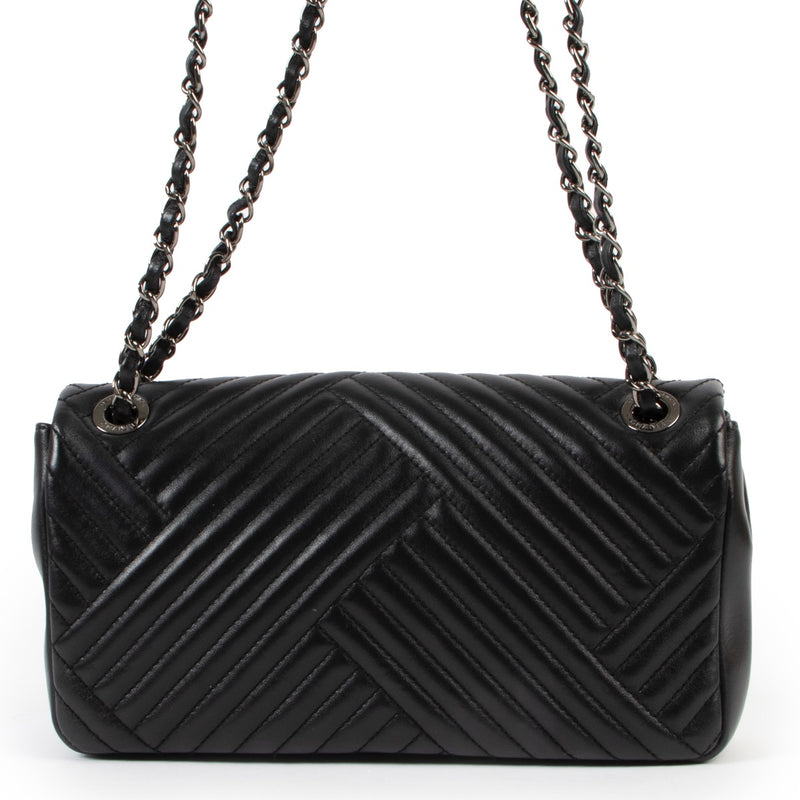 Buy an authentic second hand Chanel Black Timeless Chevron Flap Bag at Labellov