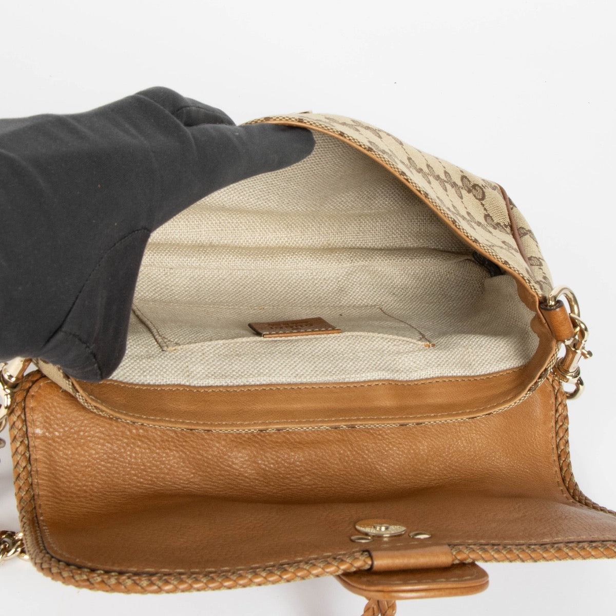 Authentic pre-loved Gucci GG Canvas Marrakech Chain Clutch on Labellov.com