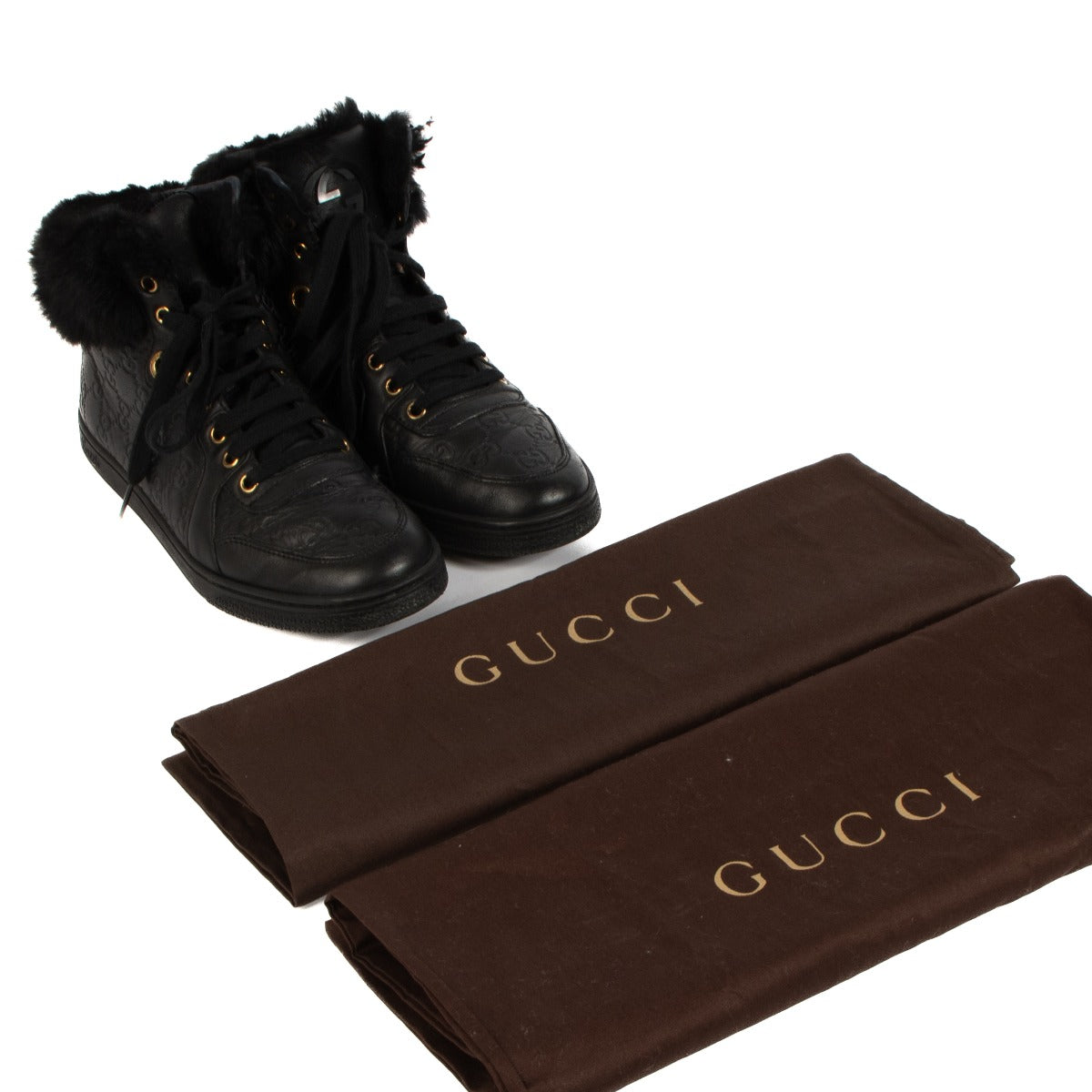 Shop safe online at Labellov in Antwerp, Brussels and Knokke this 100% authentic second hand Gucci Black Leather Fur Trim Guccissima High-top Sneakers - Size 38,5