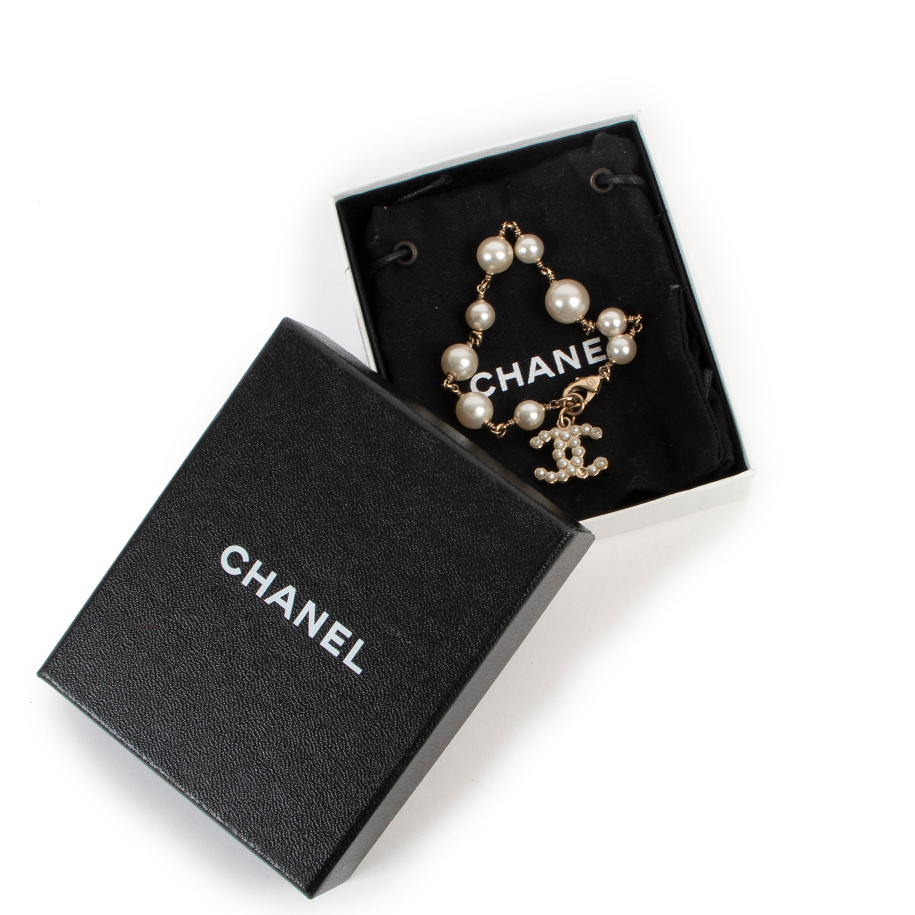 Buy an authentic second hand Chanel faux white pearls bracelet at Labellov