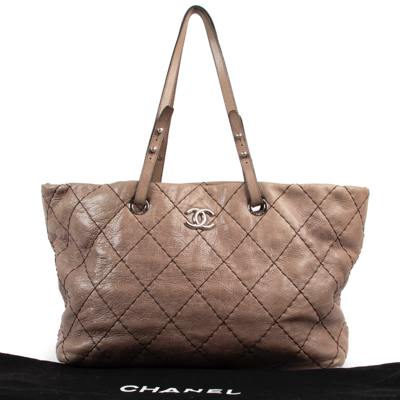 Shop safe online at Labellov in Antwerp this 100% authentic second hand Chanel Taupe Quilted Glazed Leather On-The-Road Shoulder Bag