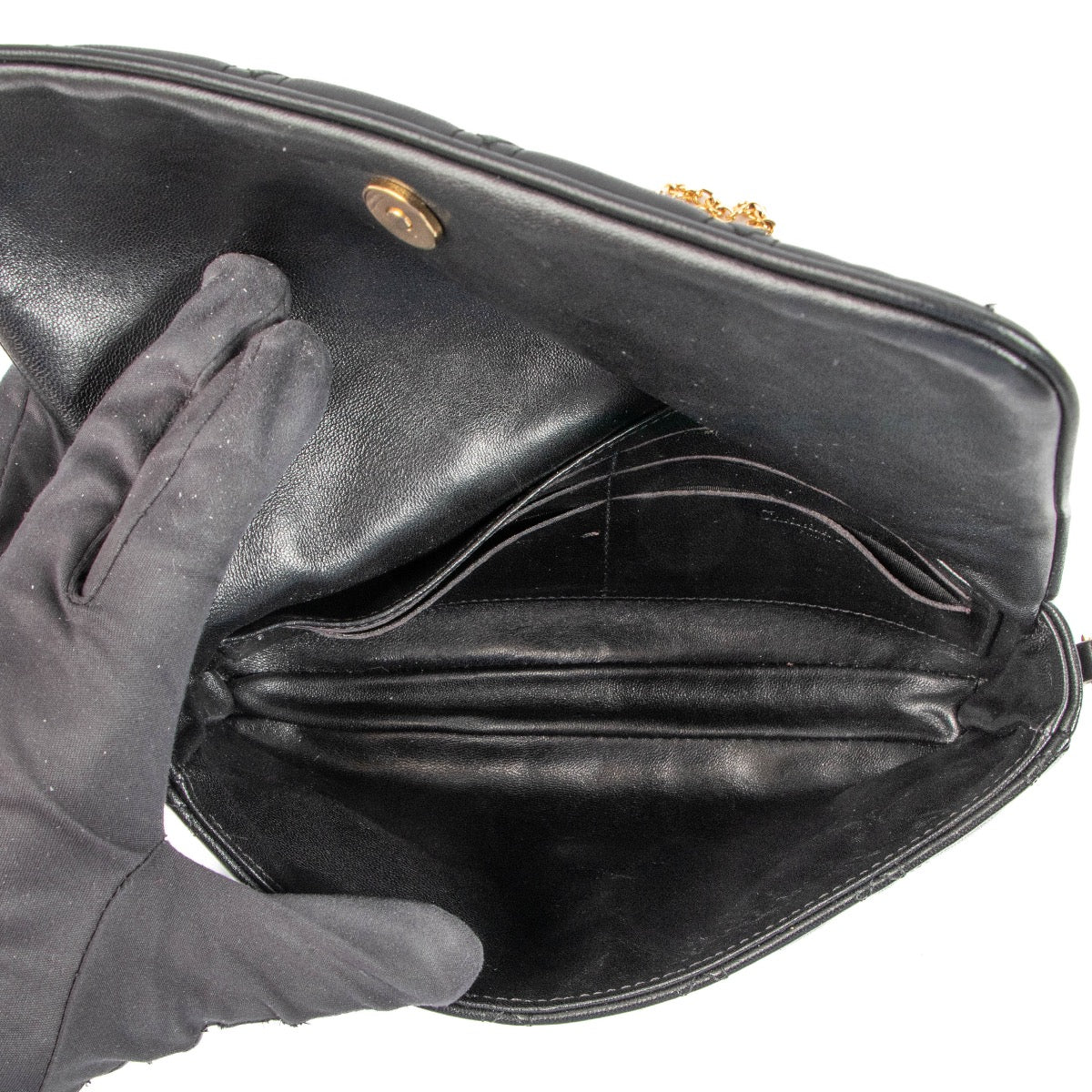 Christian Dior Black Lady Dior Clutch for the best price at Labellov secondhand luxury in Antwerp. We buy and sell your preloved and new designer bags.