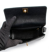 shop a 100% authentic second hand Chanel Vintage Black Caviar Mini Top Handle Bag at Labellov
