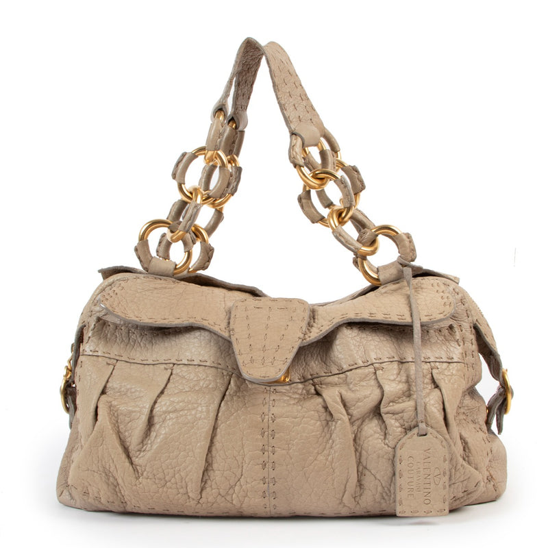 Shop safe online Valentino beige top handle bag, Shop online 100% authentic Valentino bag. Preloved Valentino top handle bag in very good condition.