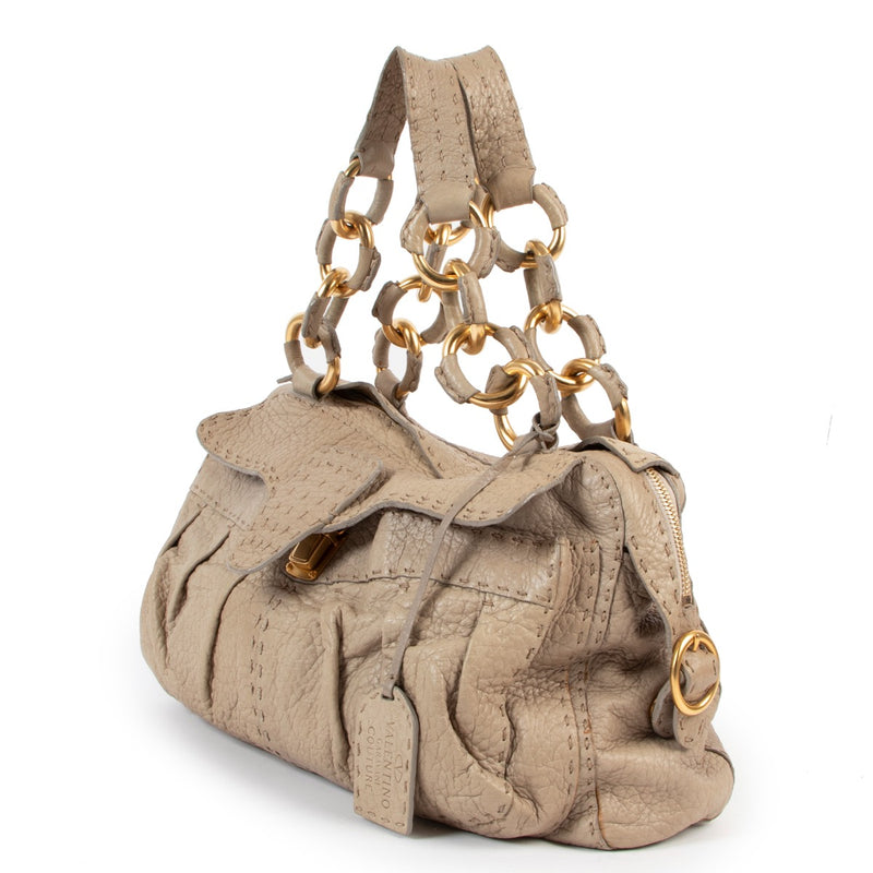 Shop safe online Valentino beige top handle bag, Shop online 100% authentic Valentino bag. Preloved Valentino top handle bag in very good condition.