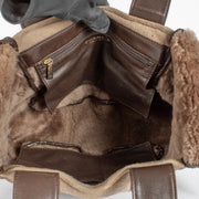 Authentic pre-loved Chanel CC Logo Suede Brown Shearling Bag on Labellov.com