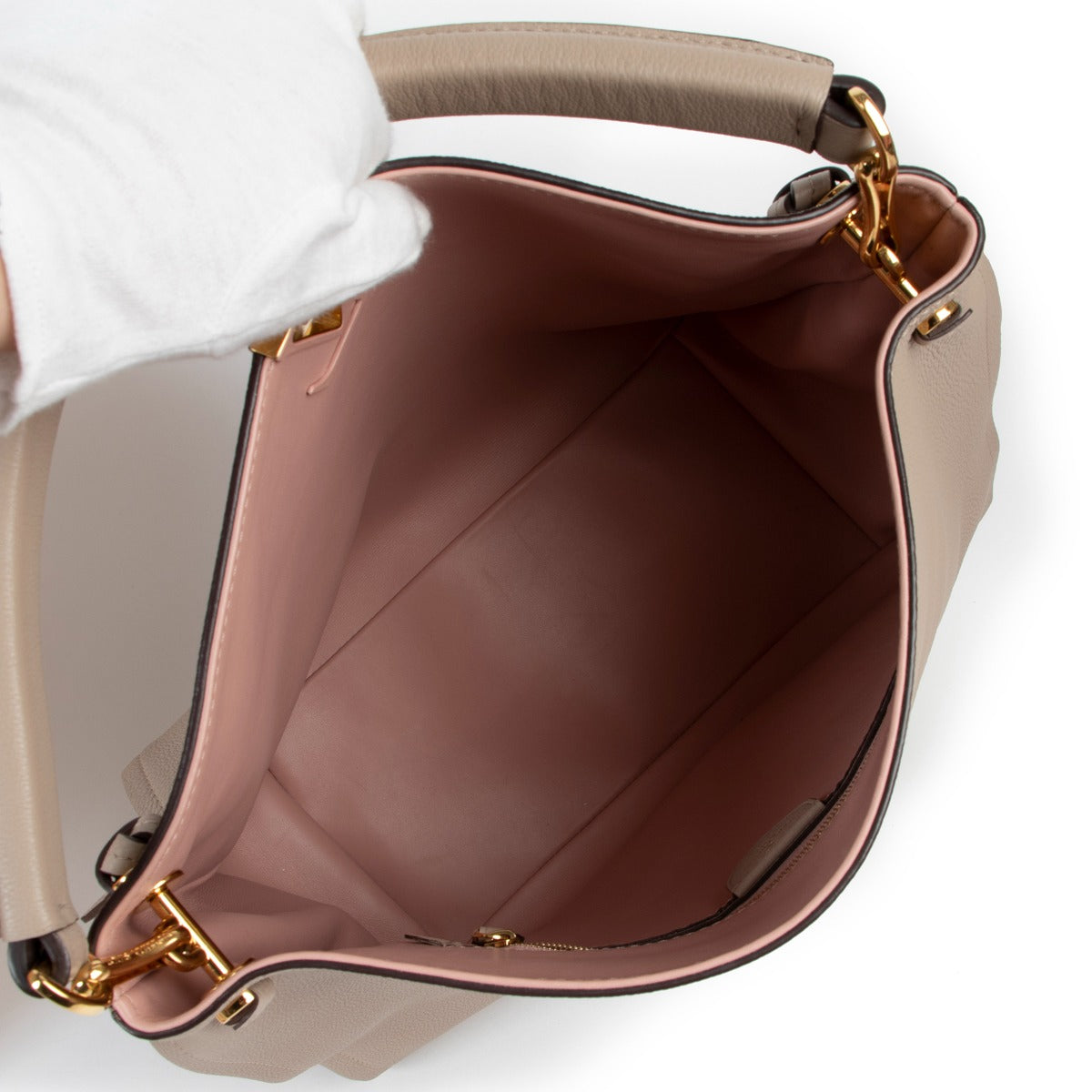 Shop authentic second hand designer luxury Louis Vuitton Tournon Galet Taurillon Leather Hobo Bag at Labellov.