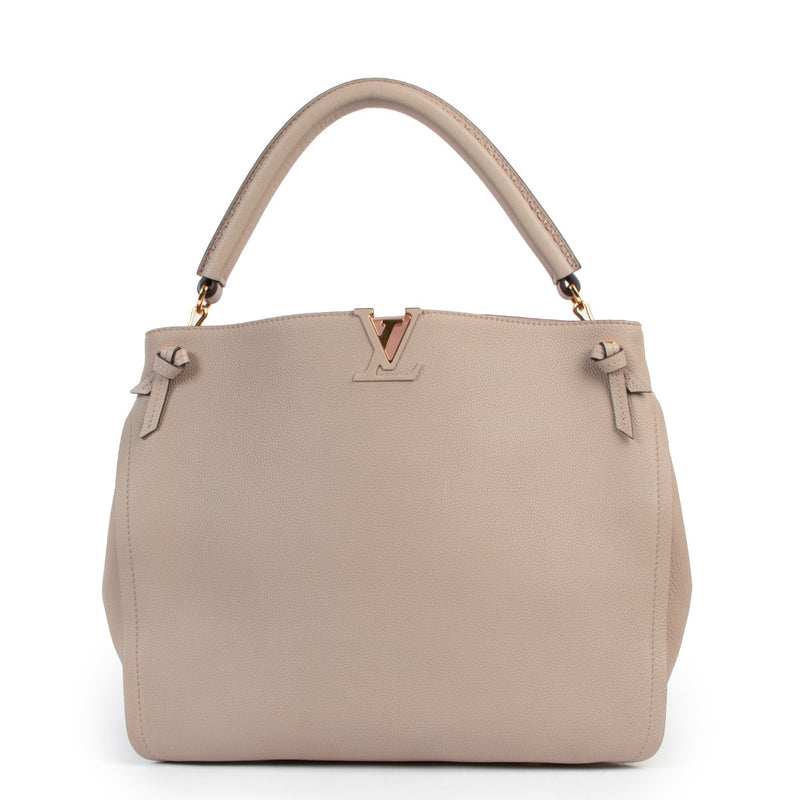 Shop authentic second hand designer luxury Louis Vuitton Tournon Galet Taurillon Leather Hobo Bag at Labellov.