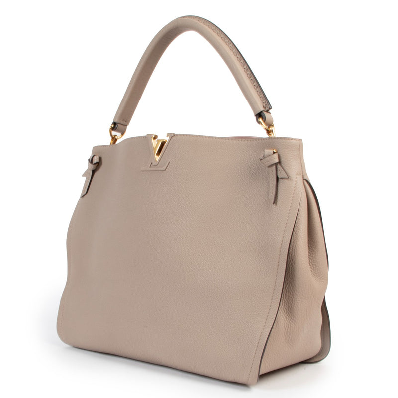 Shop authentic second hand designer luxury Louis Vuitton Tournon Galet Taurillon Leather Hobo Bag at Labellov.