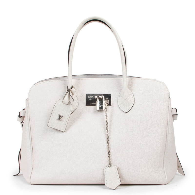 Buy an authentic second hand Louis Vuitton Milla MM White Leather Top Handle in as new at Labellov