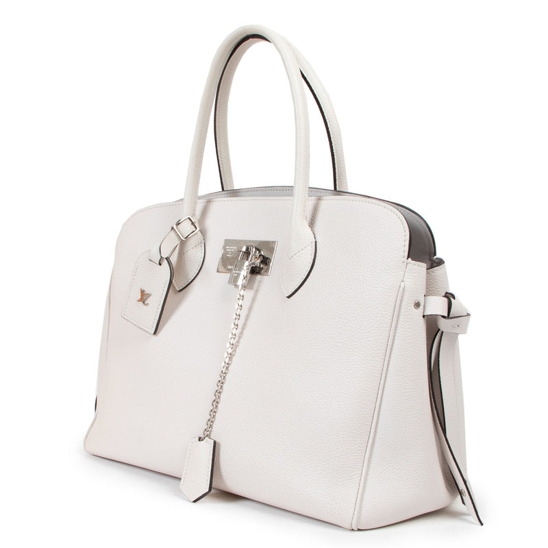 Buy an authentic second hand Louis Vuitton Milla MM White Leather Top Handle in as new at Labellov