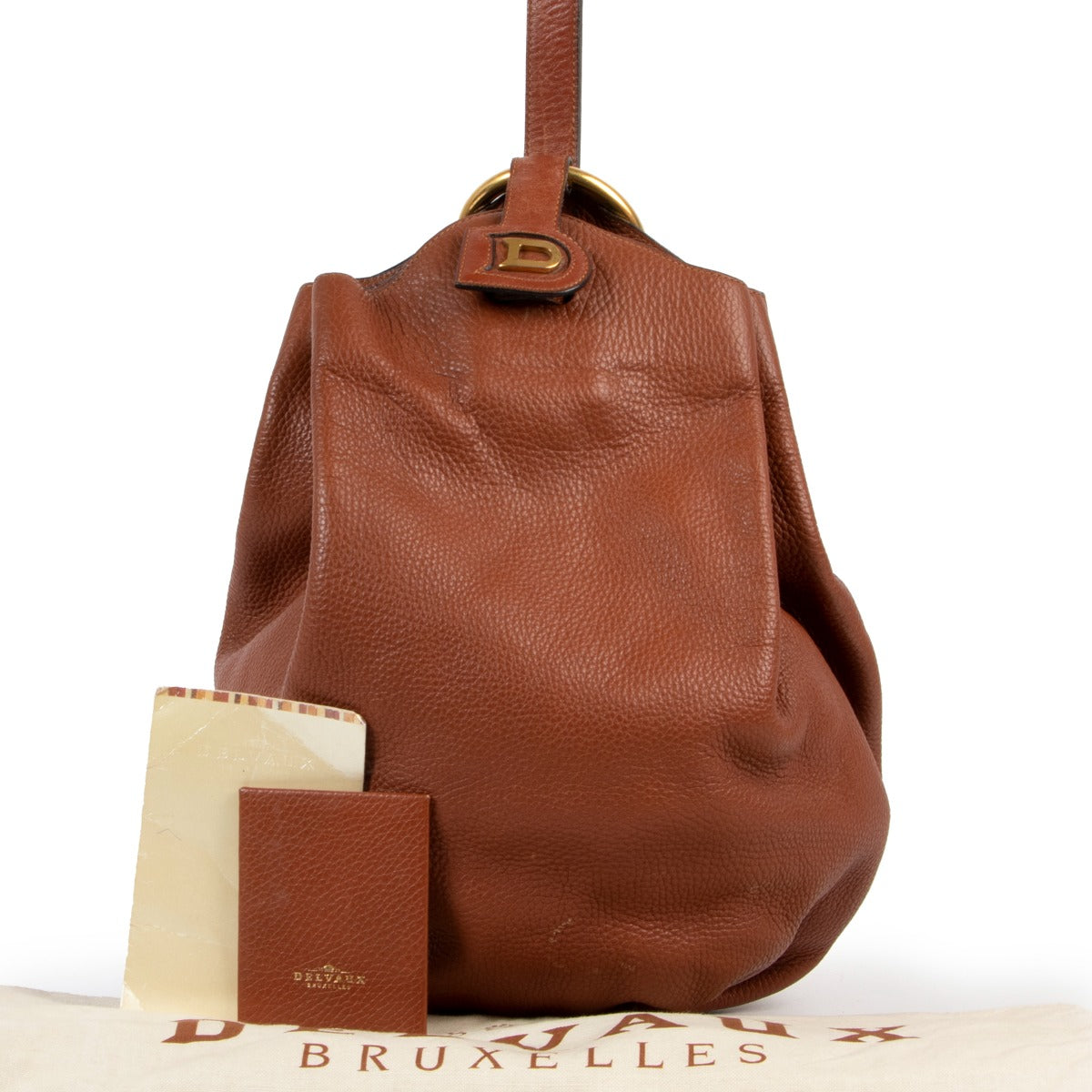 Shop vintage second hand designer luxury Delvaux Caramel Brown Vintage Bucket Bag at Labellov.