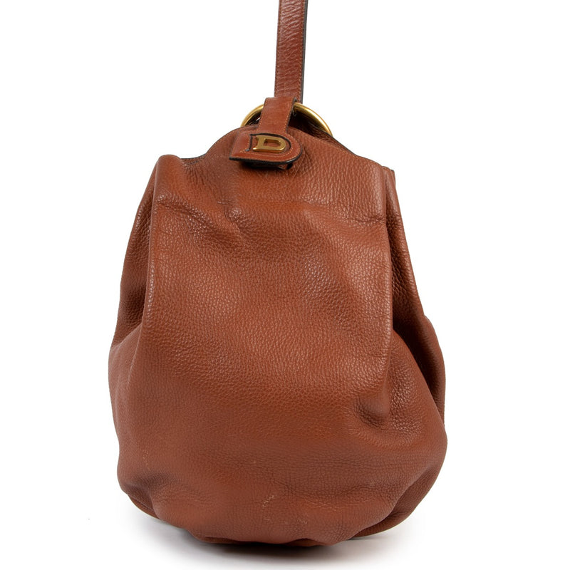 Shop vintage second hand designer luxury Delvaux Caramel Brown Vintage Bucket Bag at Labellov.