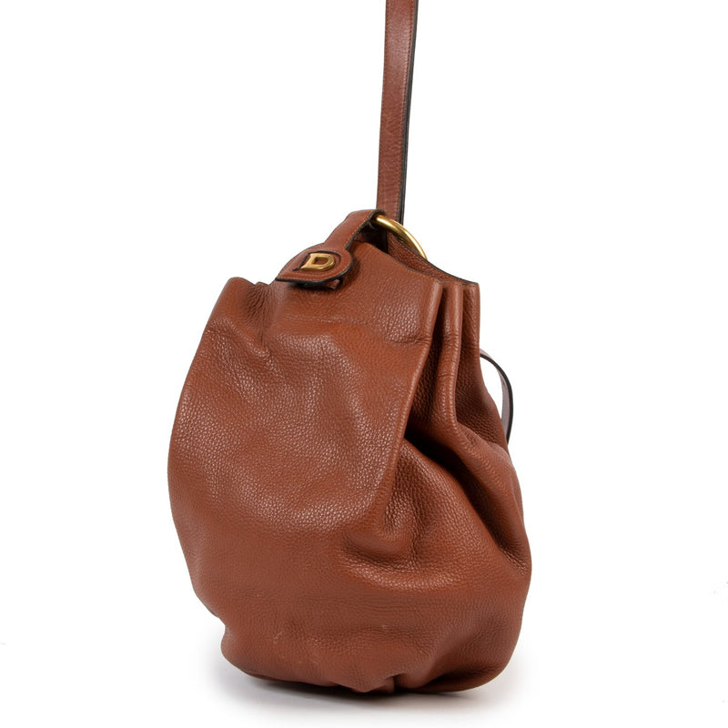 Shop vintage second hand designer luxury Delvaux Caramel Brown Vintage Bucket Bag at Labellov.