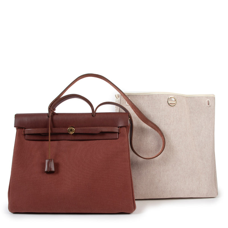 Shop safe online at Labellov in Antwerp this 100% authentic second hand Hermès Burgundy and Beige Retourne Top Handle Herbag