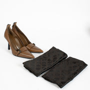 Authentic pre-loved Gucci Brown Leather Buckle Pointy-Toe Pumps — Size 37.5 on Labellov.com