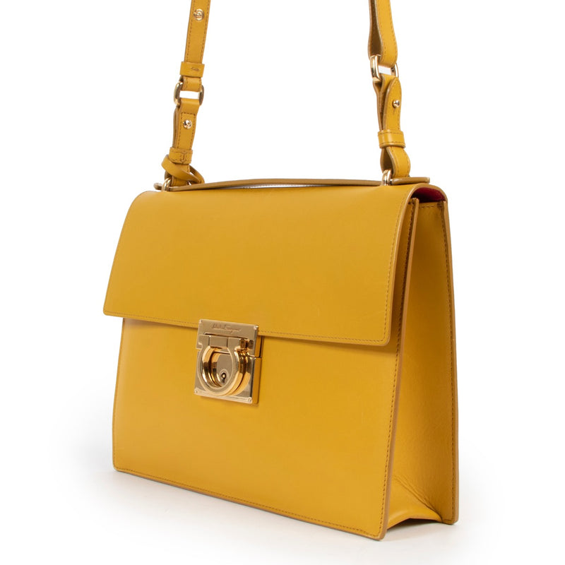 Shop safe online at Labellov in Antwerp this 100% authentic second hand Salvatore Ferragamo Mustard Crossbody