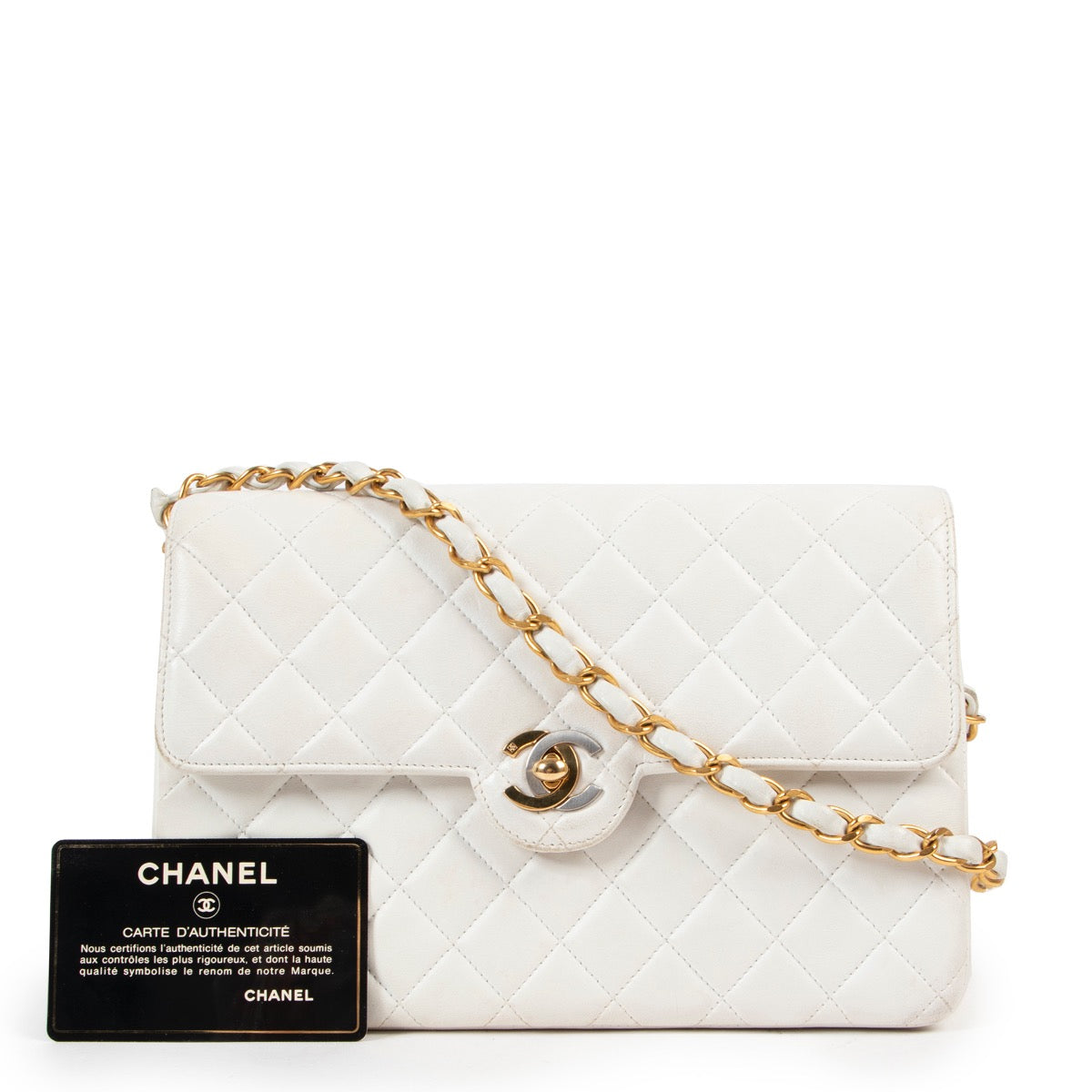 Buy an authentic second hand Chanel White Mini Classic Flap Bag in good condition at Labellov